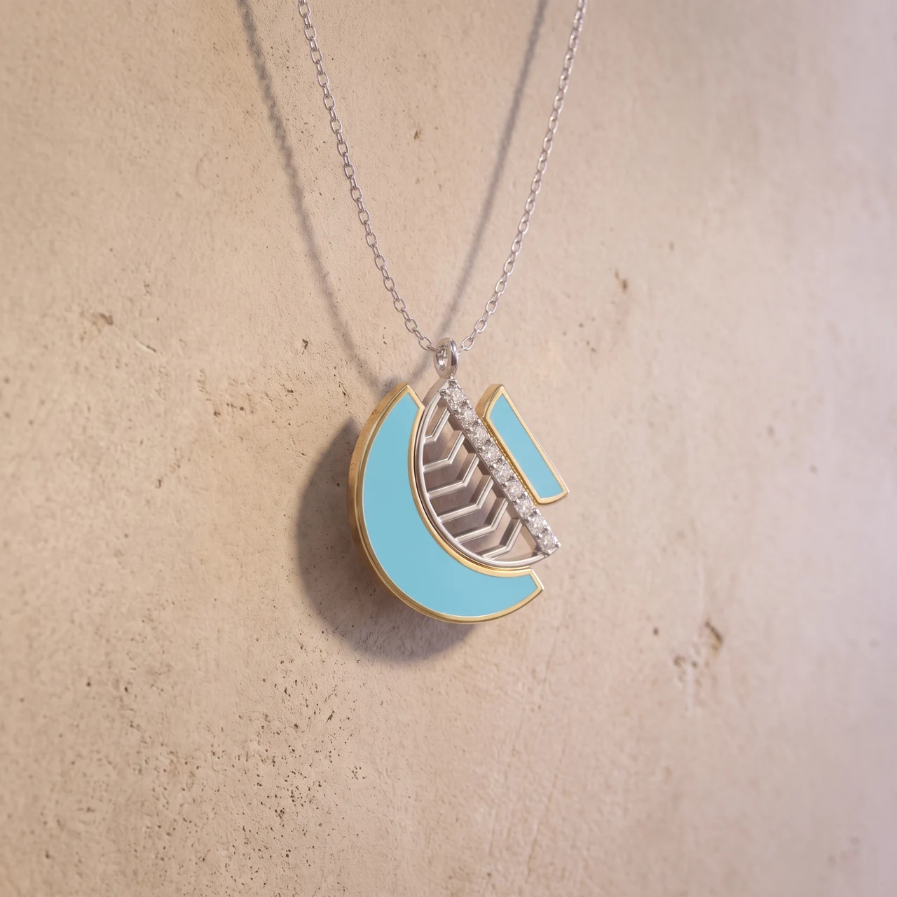 The Amara Harmony Pendant before a plaster wall
