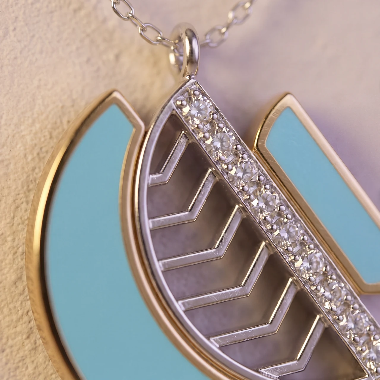The Amara Harmony openwork and pavé beside the enamel, close up